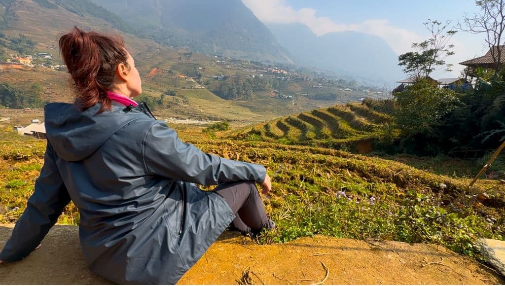 Heidi turned away looking out at the Sapa views with rice terraces