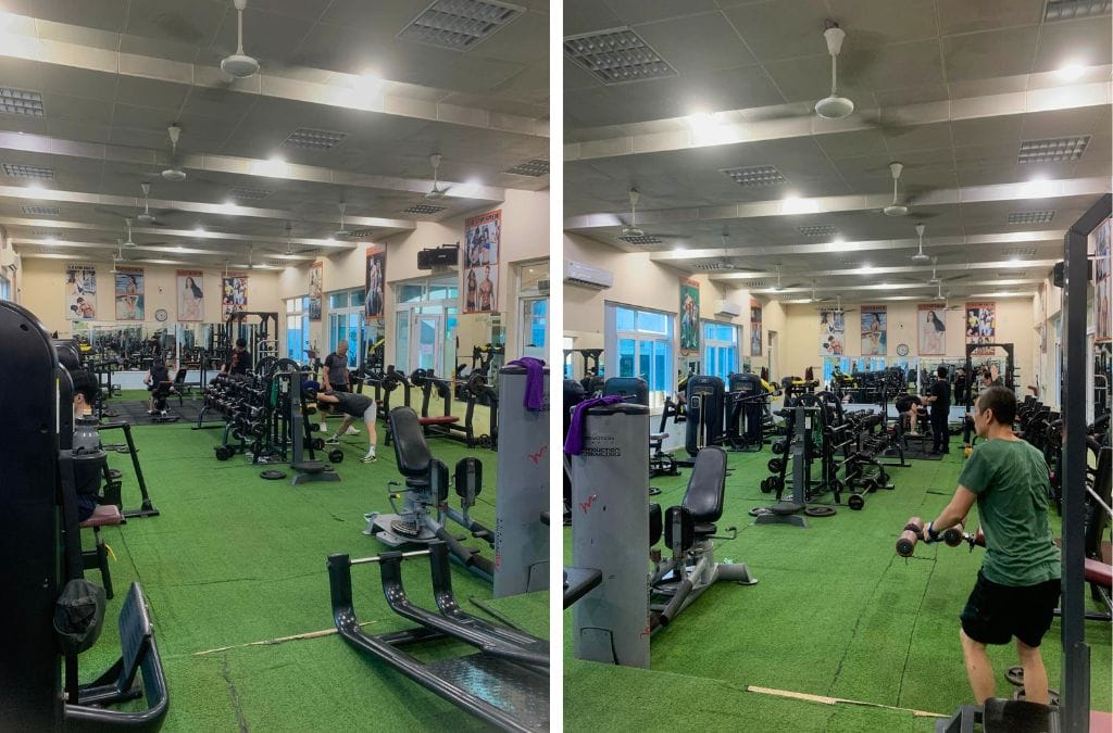 Two photos inside the X-Men Gym in Hanoi showing two angles from one side of the gym. There's various lifting machines and a lot of barbells of different weights.