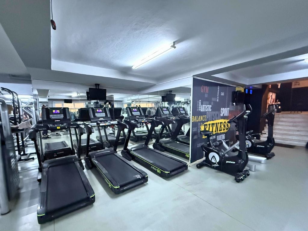 Three treadmills and two bicycles in the gym