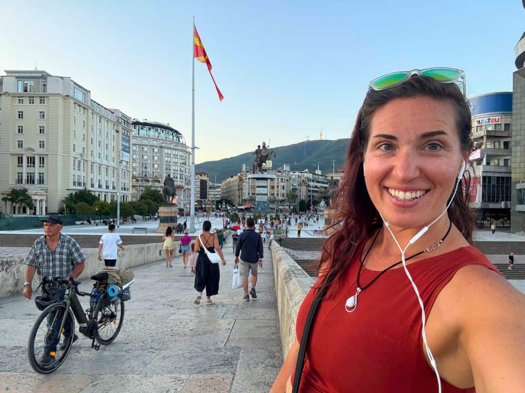Traveler wearing headphones exploring the city without a tour guide