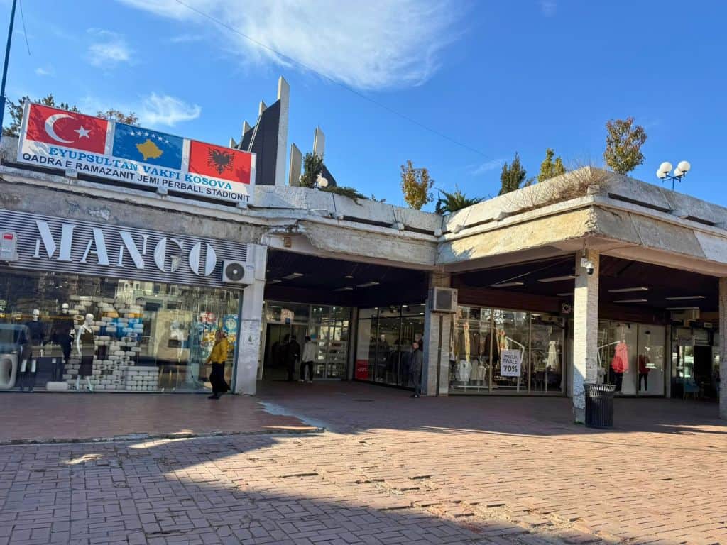 Building entrance behind Newborn monument
