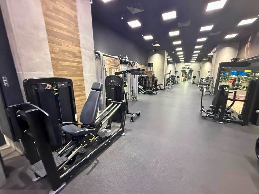 Hallway gym area with lots of equipment
