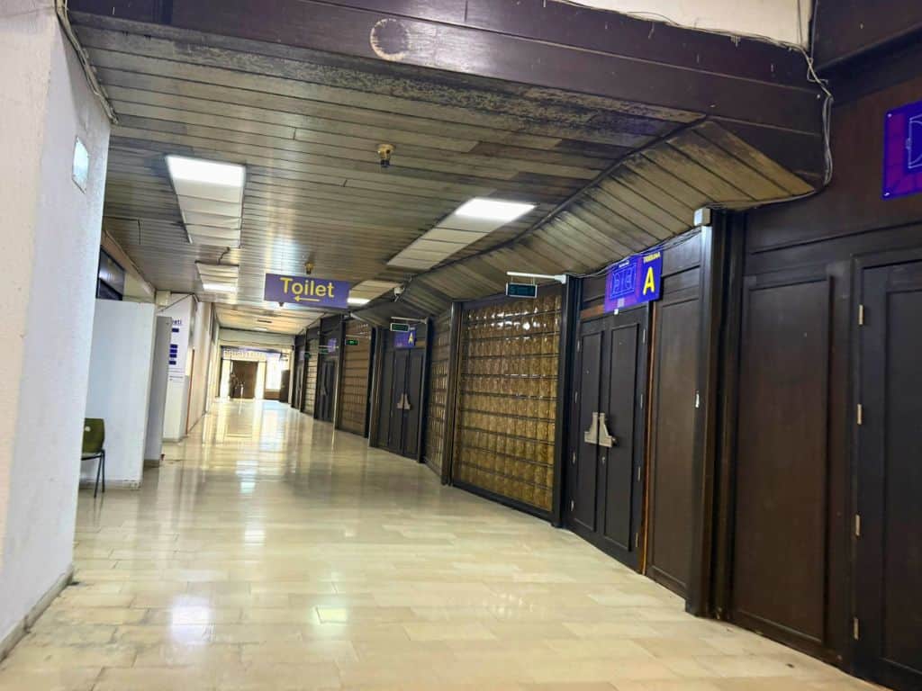 Long hallway leading down to the gym staircase
