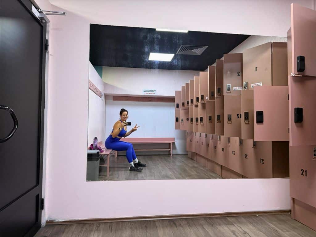 Locker room with author, Heidi, smiling in mirror